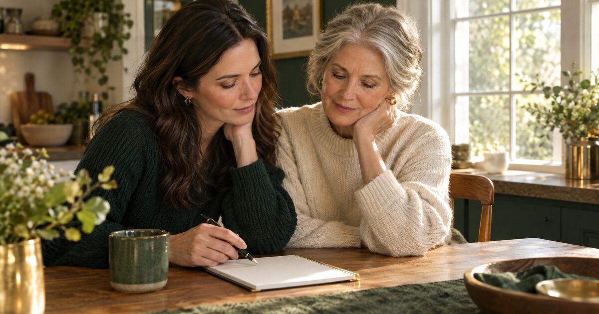 An adult daughter and her mother talking together at a kitchen table
